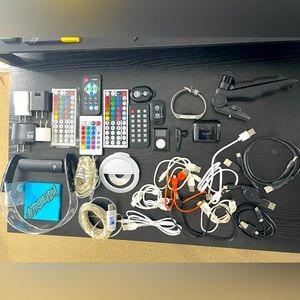 Bundle of Misc. Electronics (fitbit, samsung, mp3, remotes, battery chargers)